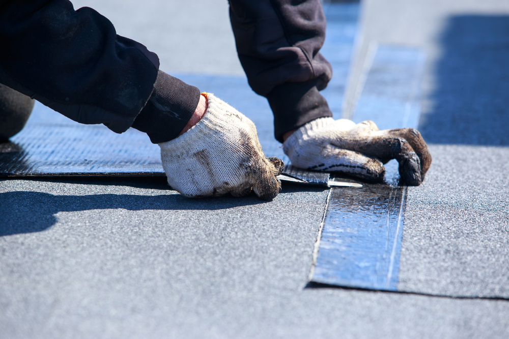 Worker,Cuts,Roofing,Material,In,The,Open,Air
